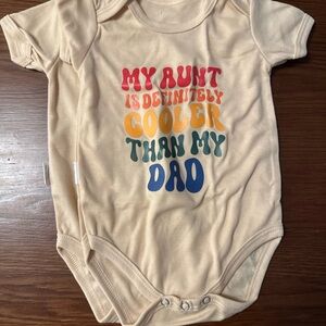 Playful Cream Bodysuit with Colorful Text